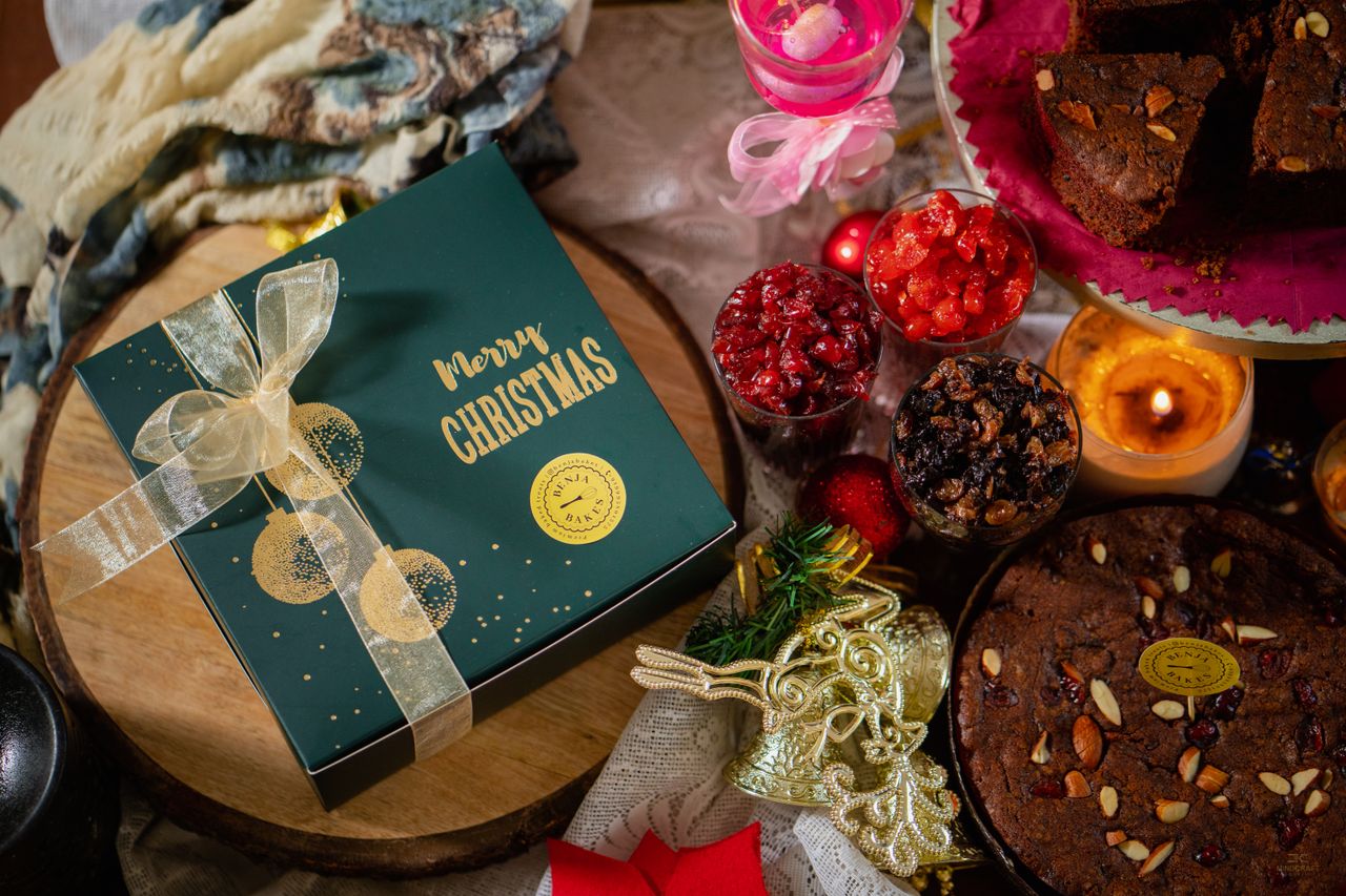 Mastering the First Impression: Your intriguing post title goes here A delicious Christmas celebration with cakes, a gift box, and festive candles.